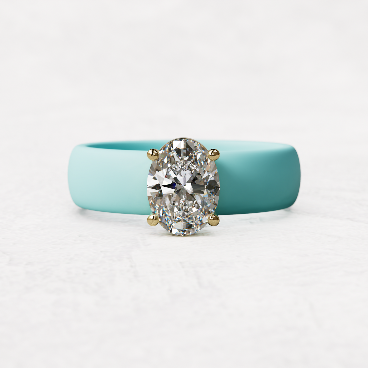 One carat oval diamond with aqua silicone band in 14 karat gold