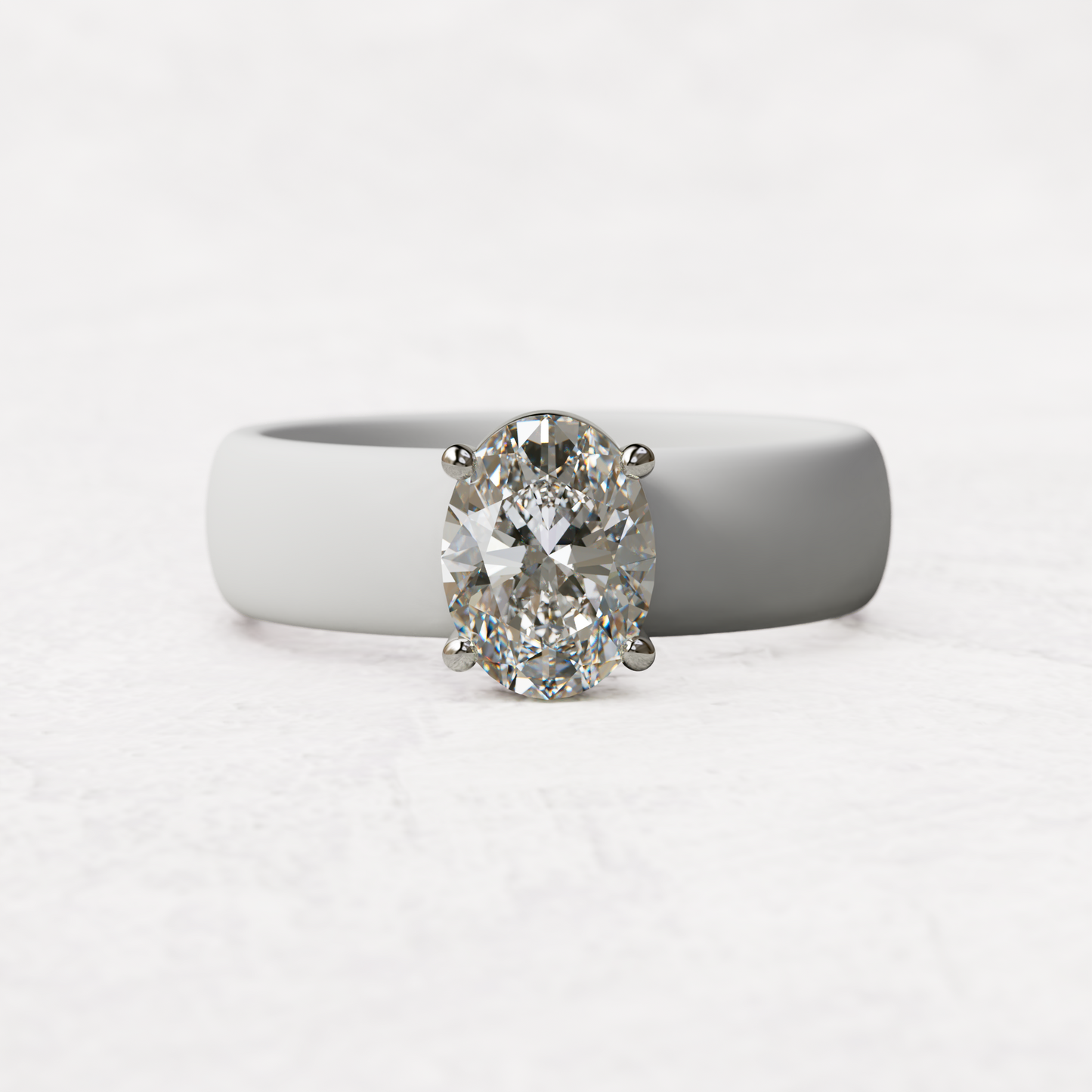 One carat oval diamond with white silicone band in 14 karat white gold