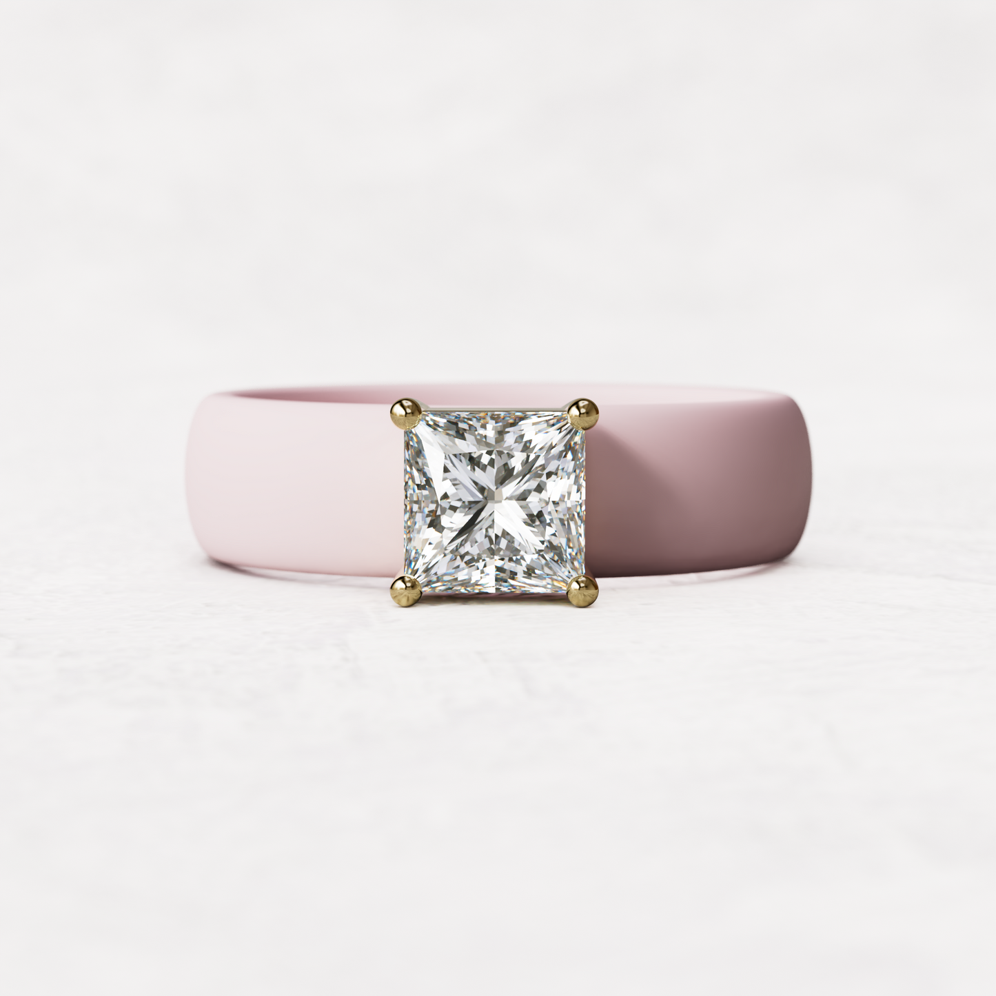 Pink silicone ring with a one carat princess cut diamond set in 14 karat Gold