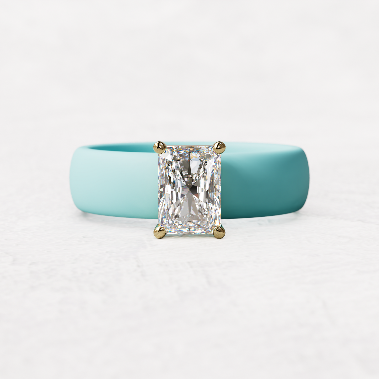 Aqua silicone band with a one carat radiant diamond set in 14 karat Gold