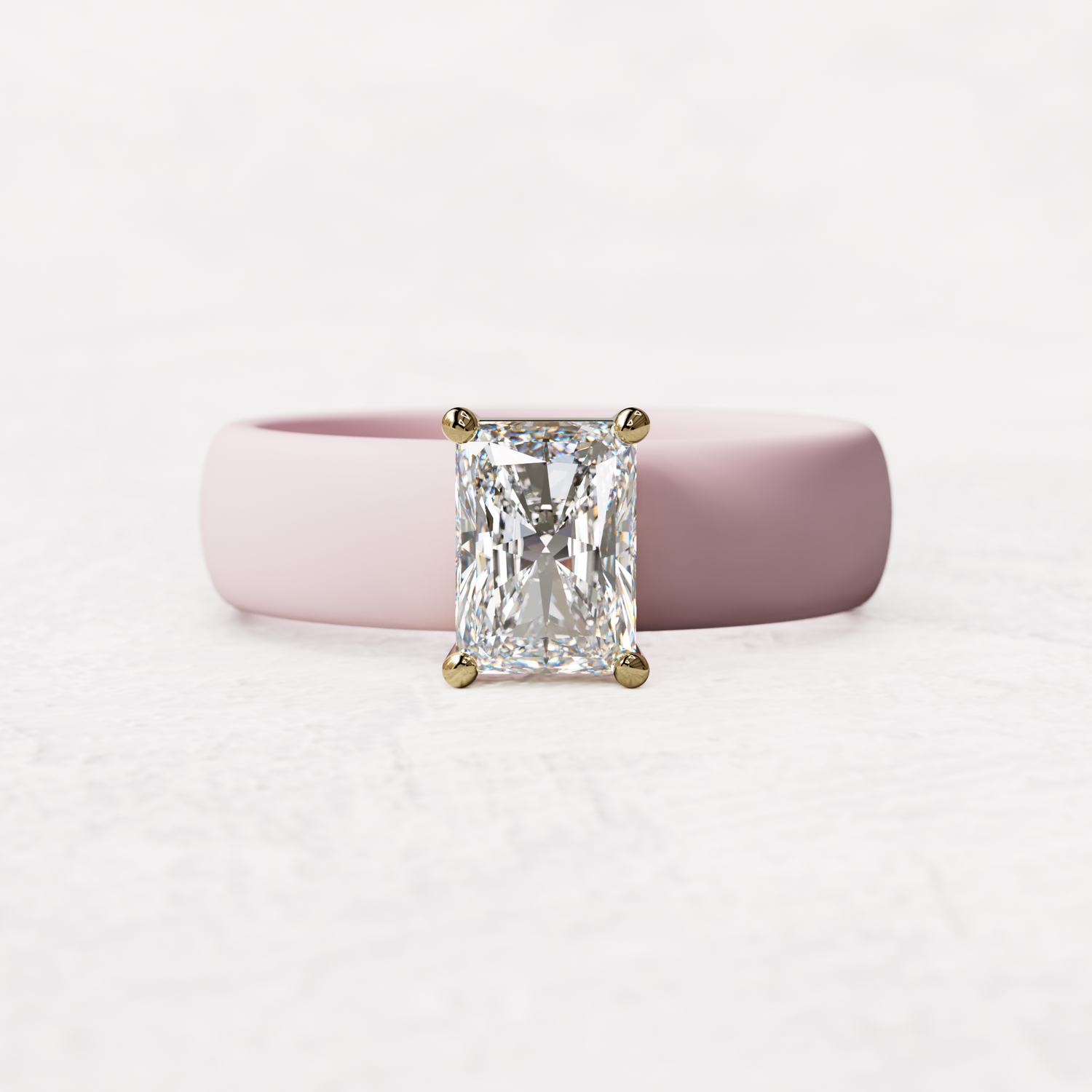 Pink silicone band with a one carat radiant diamond set in 14 karat Gold