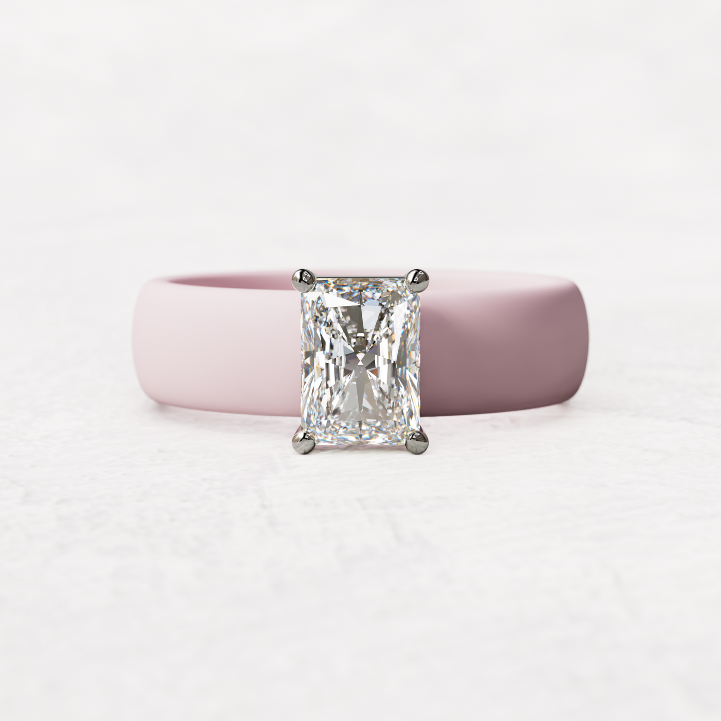 Pink silicone band with a one carat radiant diamond set in 14 karat white Gold