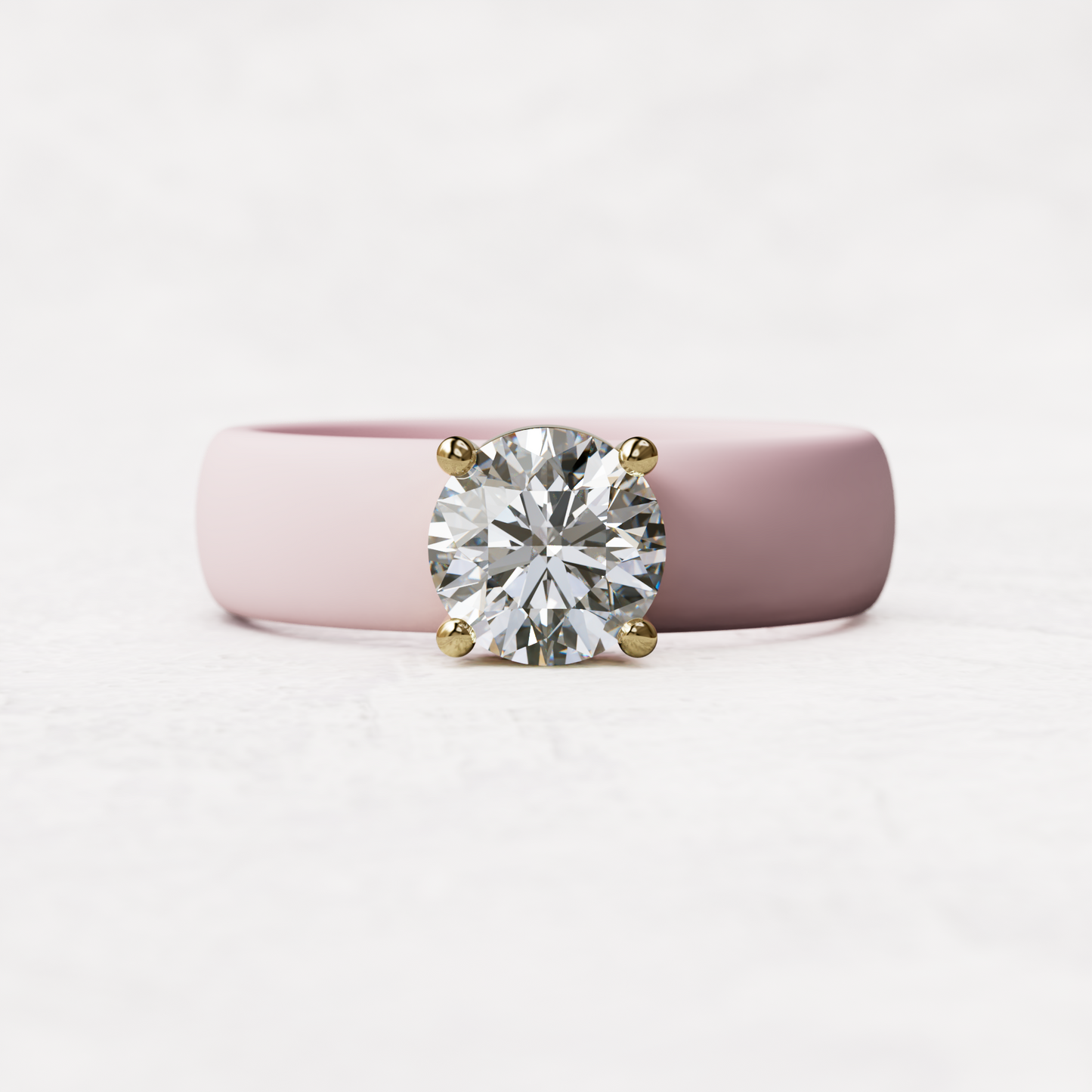 One carat round diamond with pink silicone band in 14 karat gold