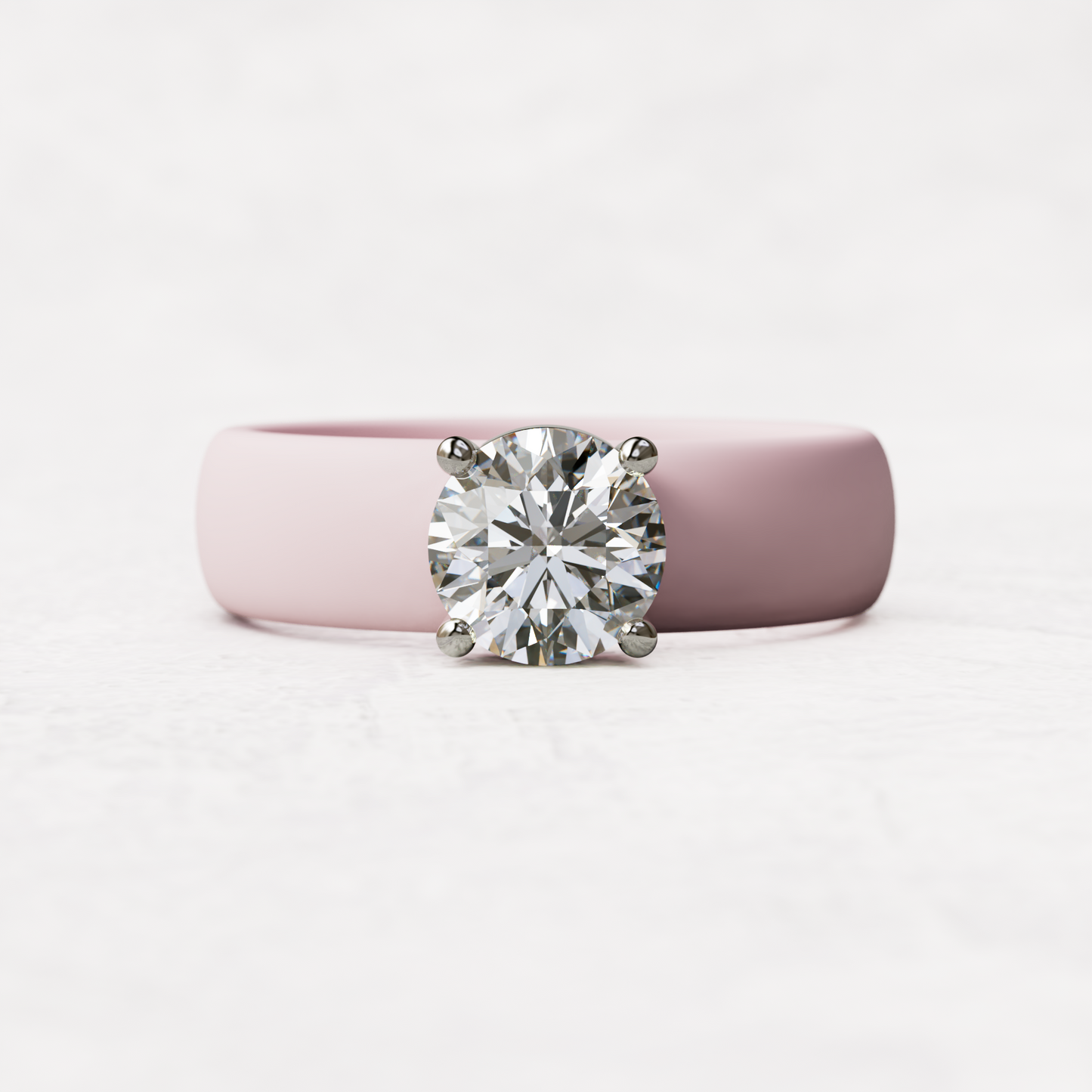 One carat round diamond with pink silicone band in 14 karat white gold