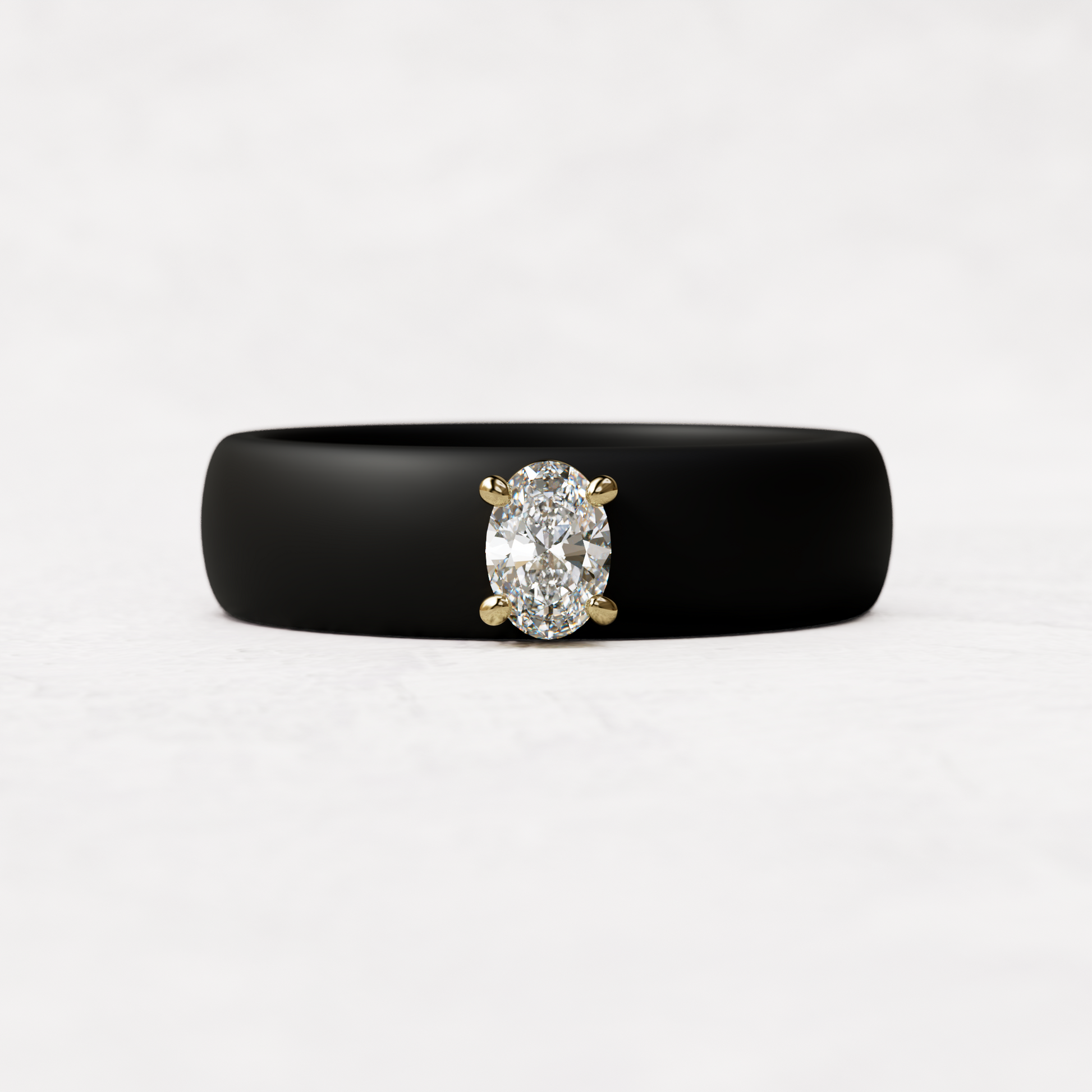 Black silicone ring with a quarter carat oval diamond set in 14 karat Gold
