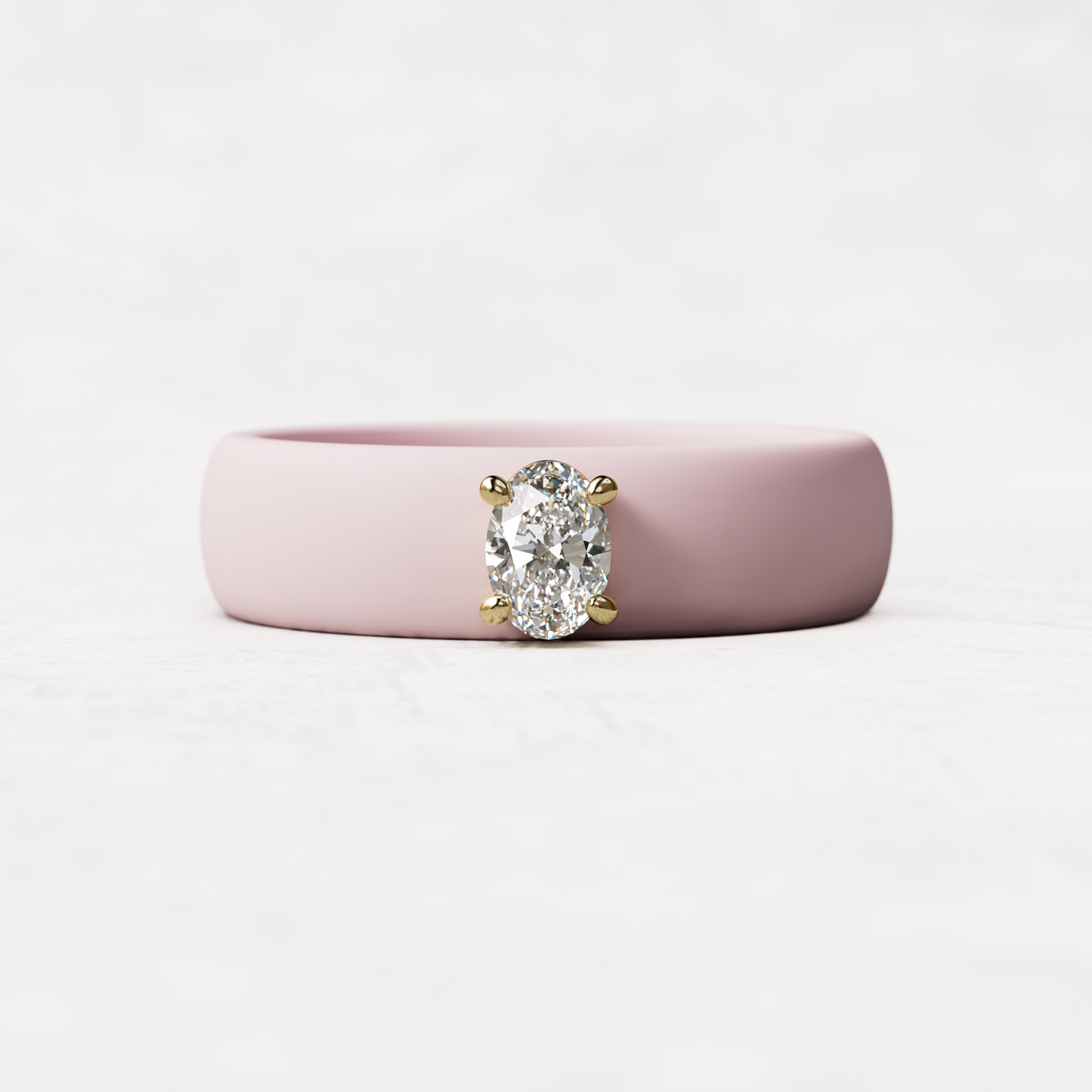 Pink silicone ring with a quarter carat oval diamond set in 14 karat Gold