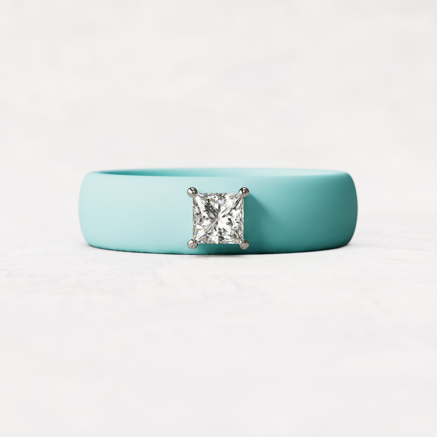 Aqua silicone ring with a quarter carat princess cut diamond set in 14 karat white Gold