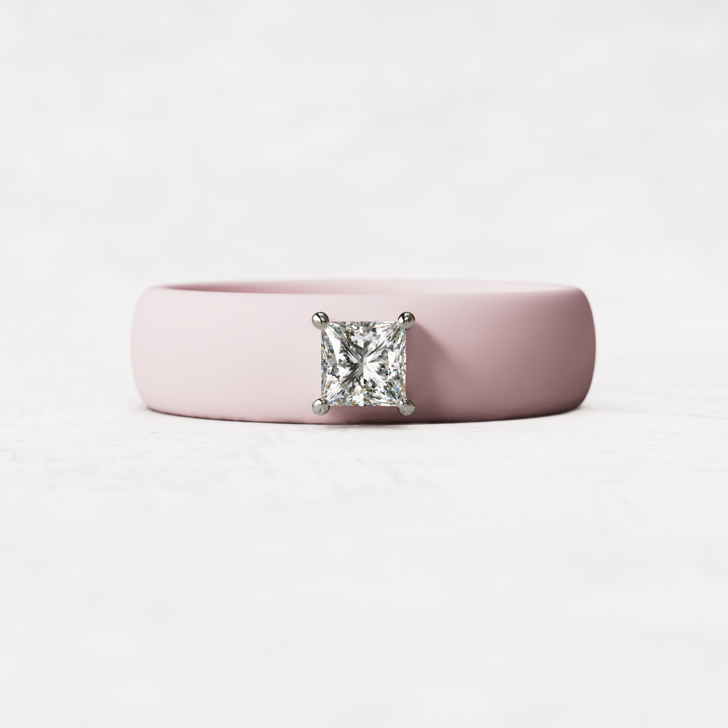 Pink silicone ring with a quarter carat princess cut diamond set in 14 karat white Gold