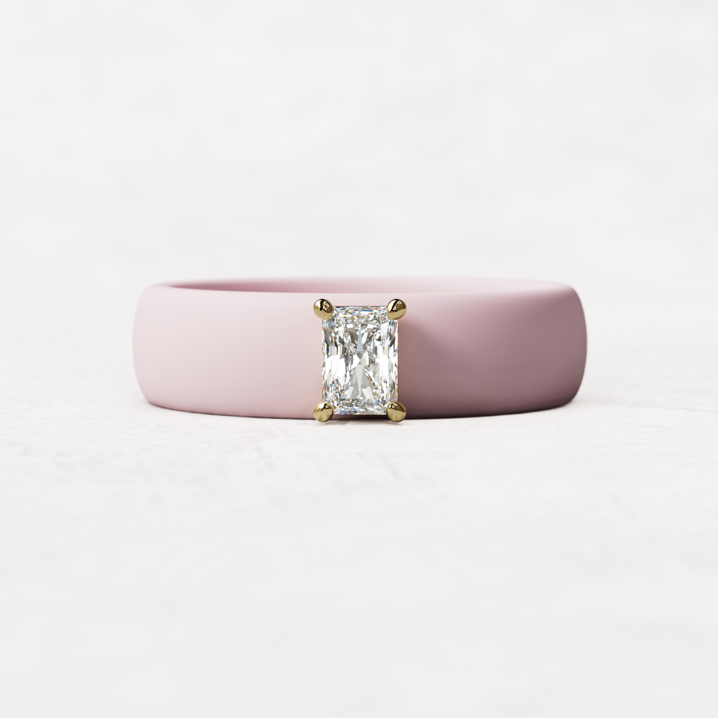 Pink silicone band with a quarter carat radiant diamond set in 14 karat Gold