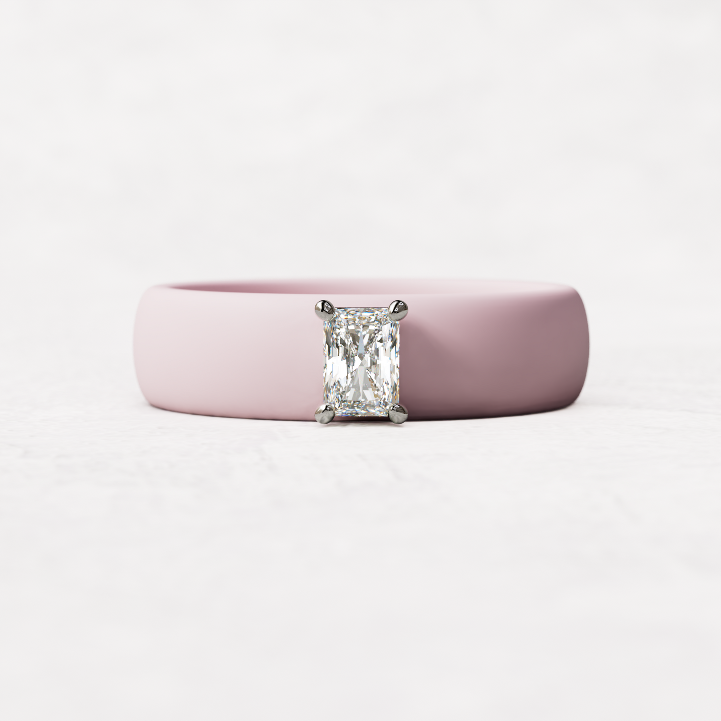 Pink silicone band with a quarter carat radiant diamond set in 14 karat white Gold