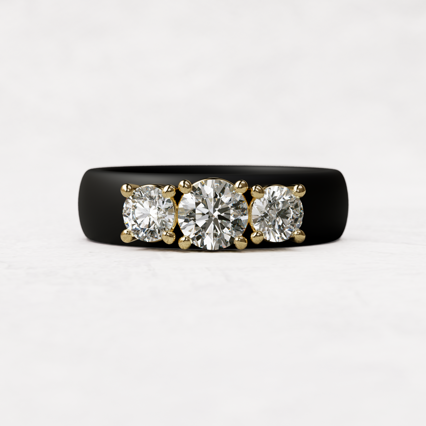 Three stone black silicone diamond ring with one half carat round diamond and two quarter carat round diamonds set in 14 karat gold