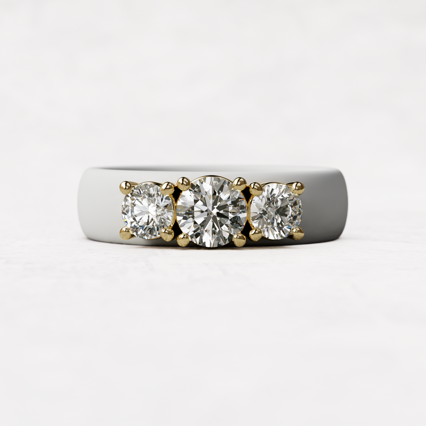 Three stone white silicone diamond ring with one half carat round diamond and two quarter carat round diamonds set in 14 karat gold