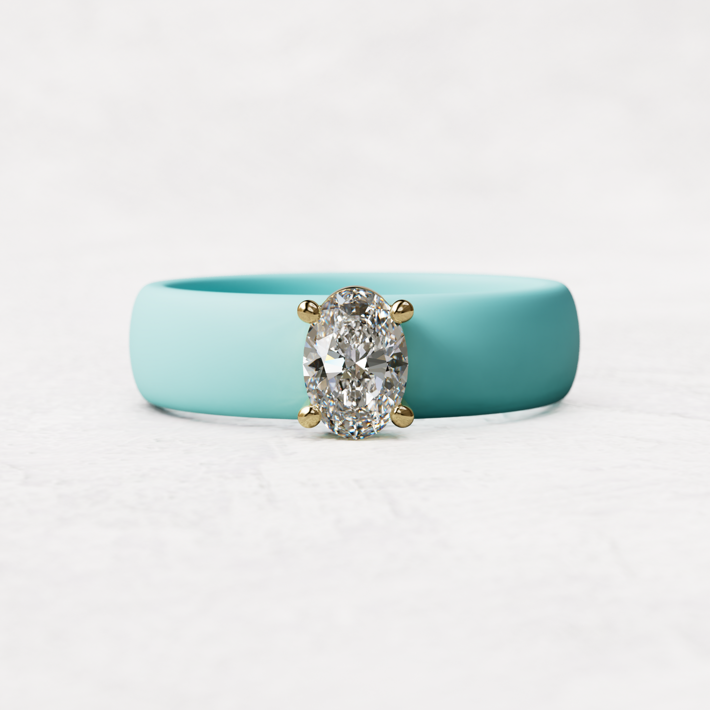 Aqua silicone ring with a half carat oval diamond set in 14 karat Gold