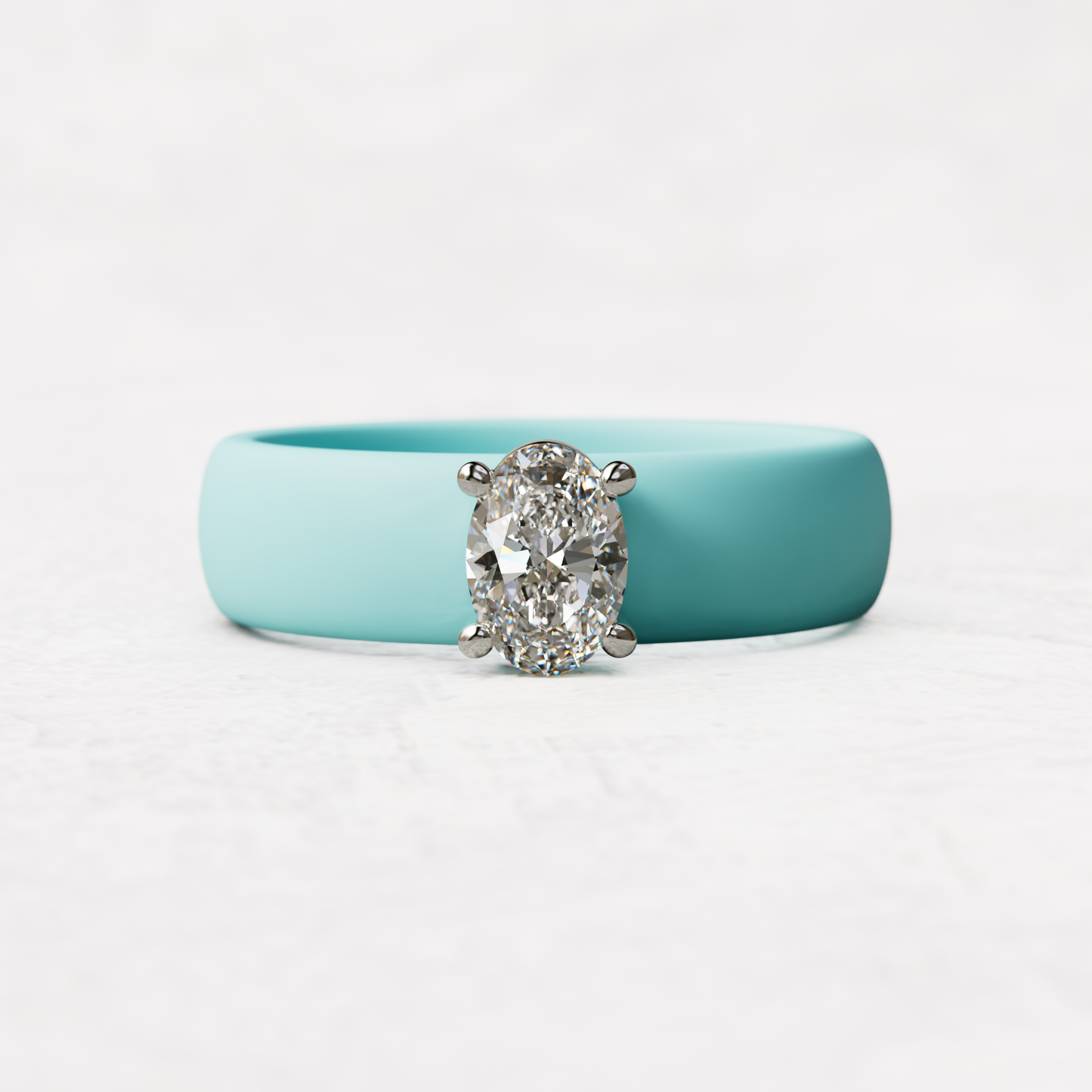 Aqua silicone ring with a half carat oval diamond set in 14 karat white Gold