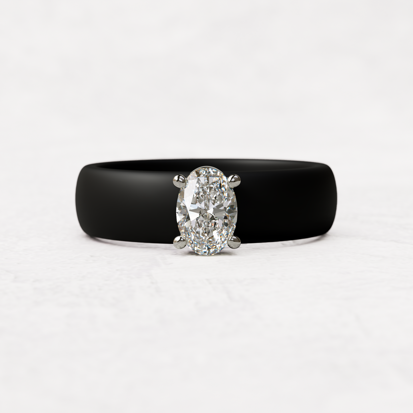 Black silicone ring with a half carat oval diamond set in 14 karat white Gold