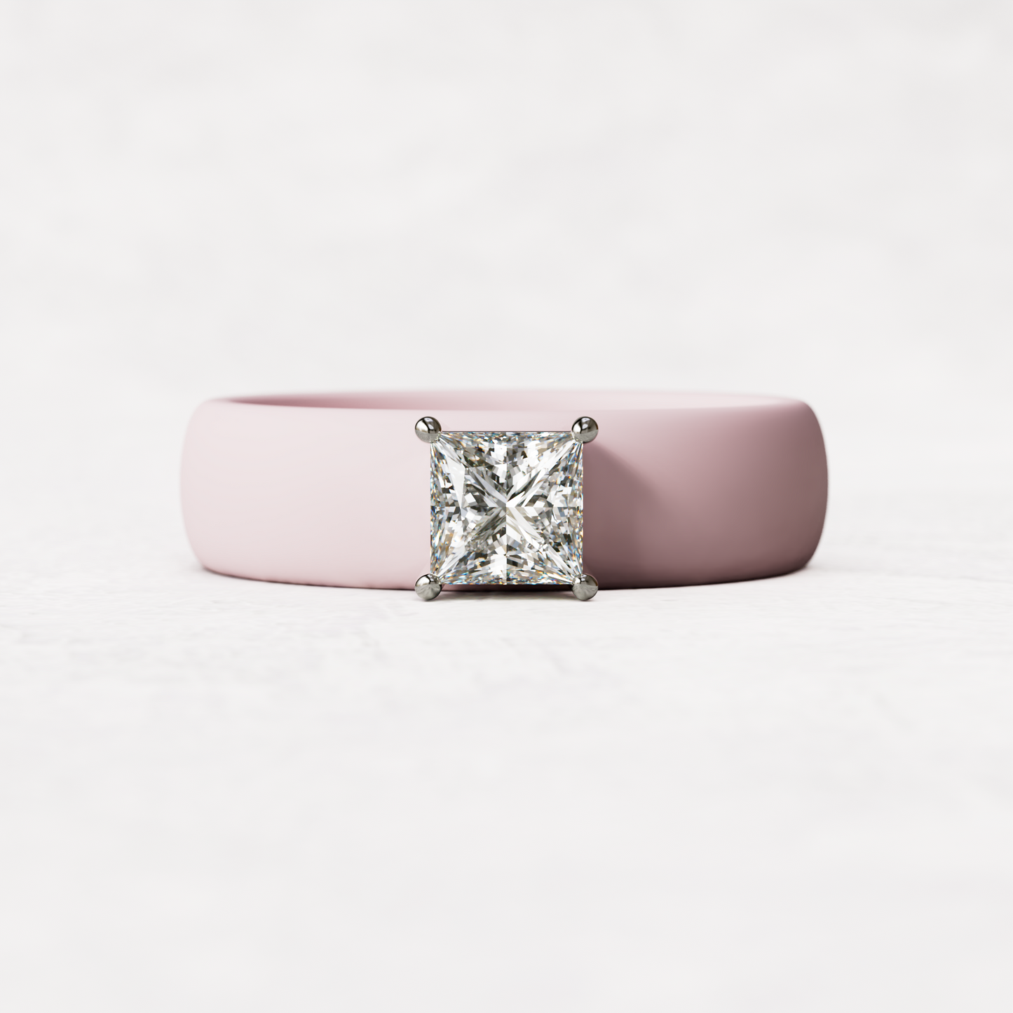 Pink silicone ring with a half carat princess cut diamond set in 14 karat white Gold