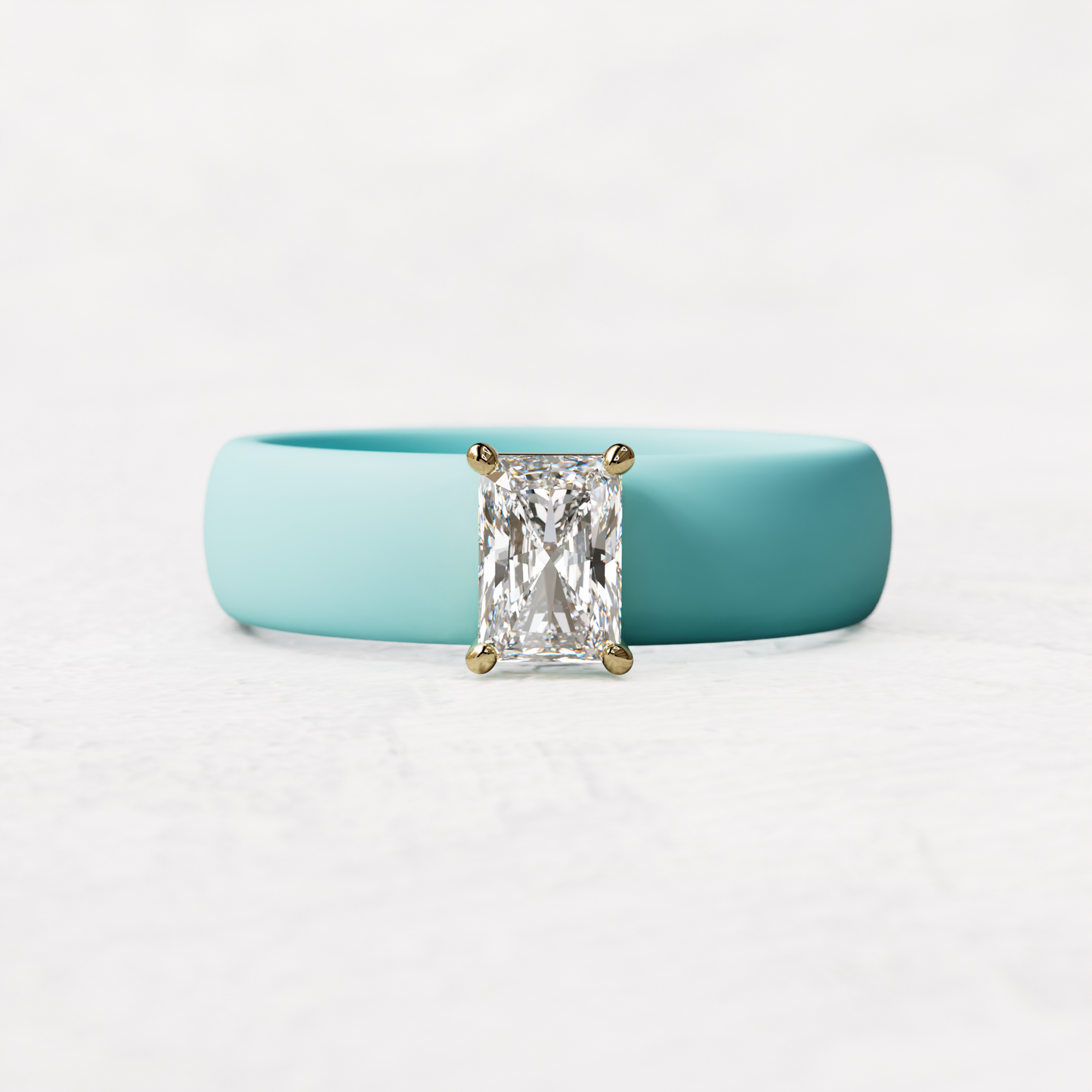 Aqua silicone band with a half carat radiant diamond set in 14 karat Gold