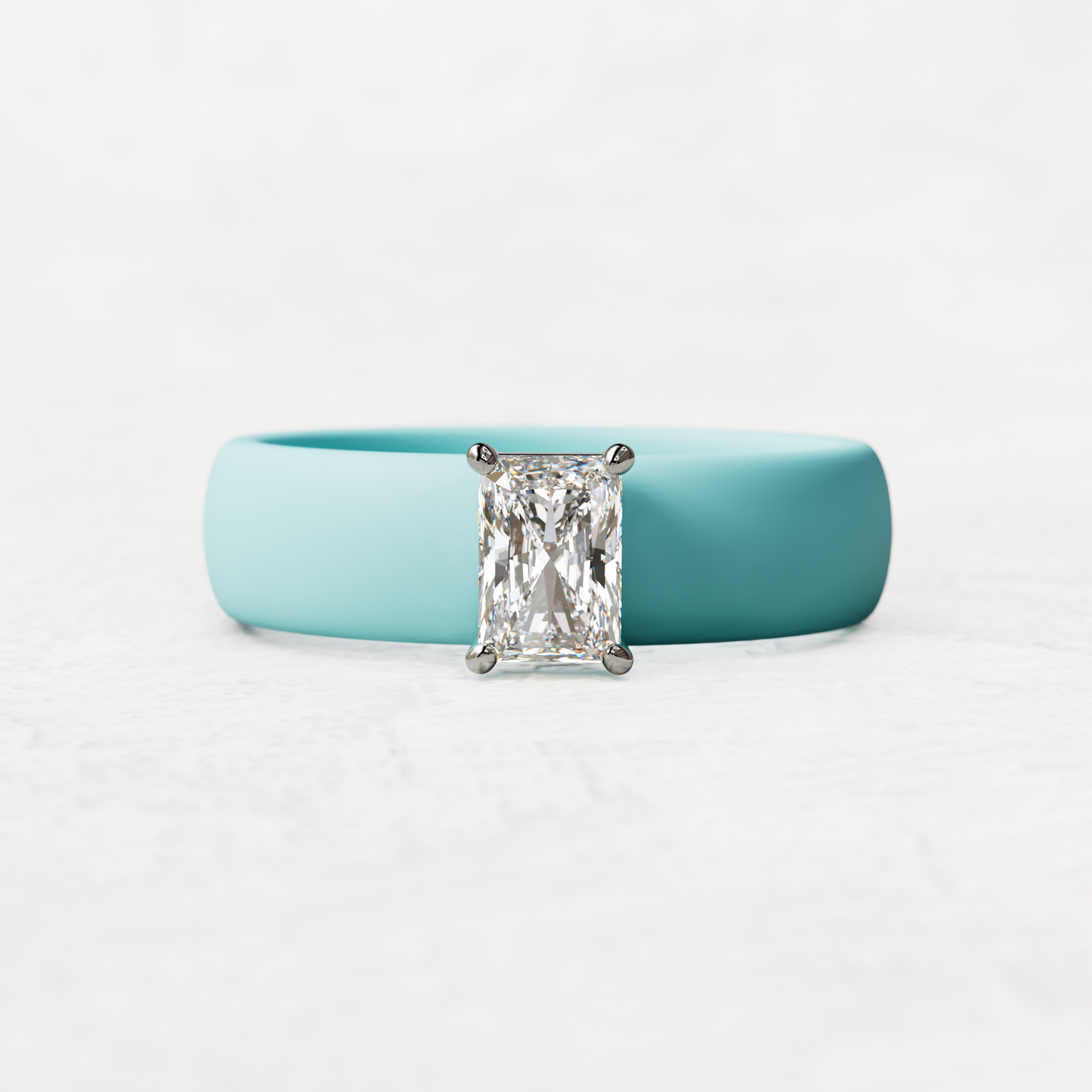 Aqua silicone band with a half carat radiant diamond set in 14 karat white Gold