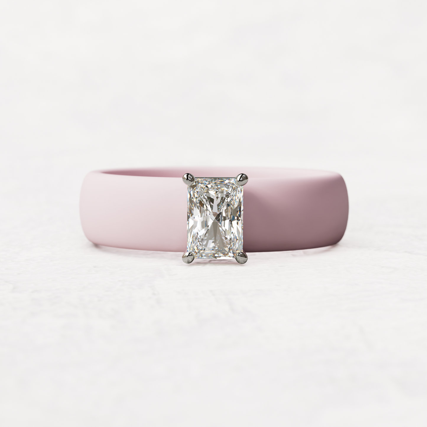 Pink silicone band with a half carat radiant diamond set in 14 karat white Gold
