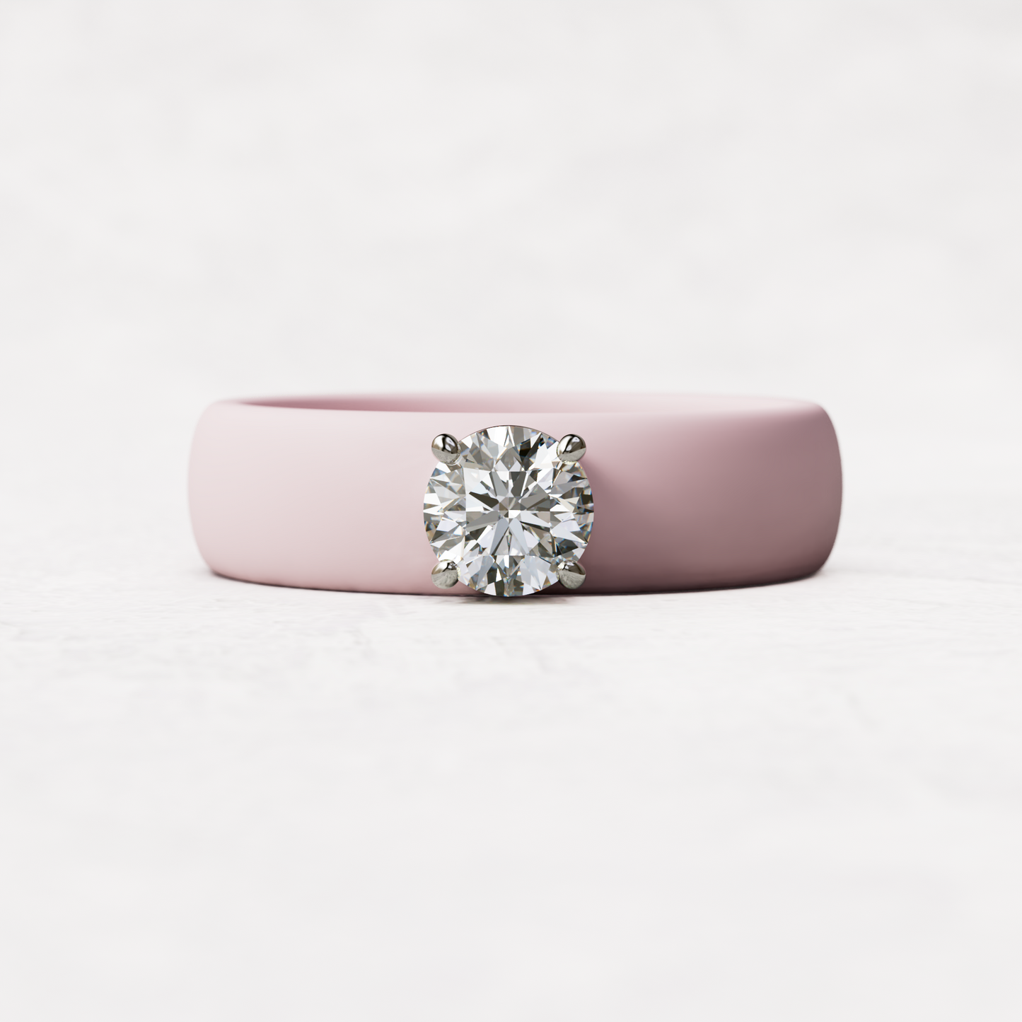 half carat round diamond withpink silicone band in 14 karat white gold