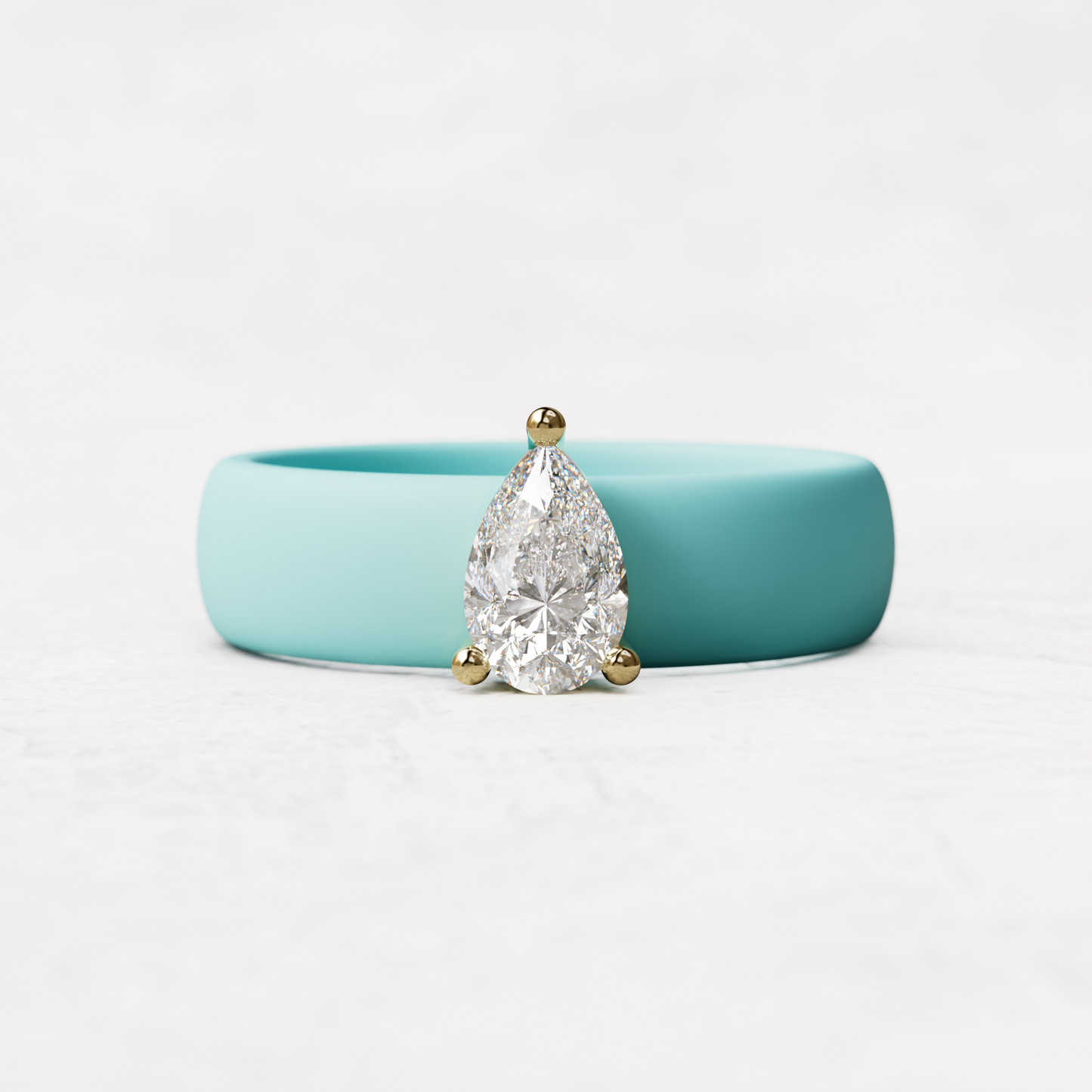 Aqua silicone band with .514 carat pear diamond set in 14 karat Gold