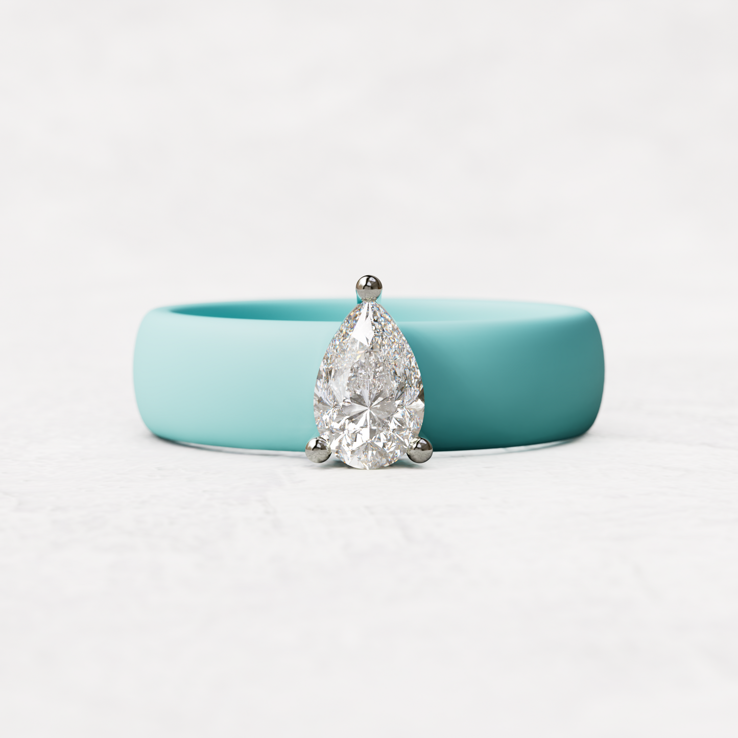 Aqua silicone band with .514 carat pear diamond set in 14 karat white Gold