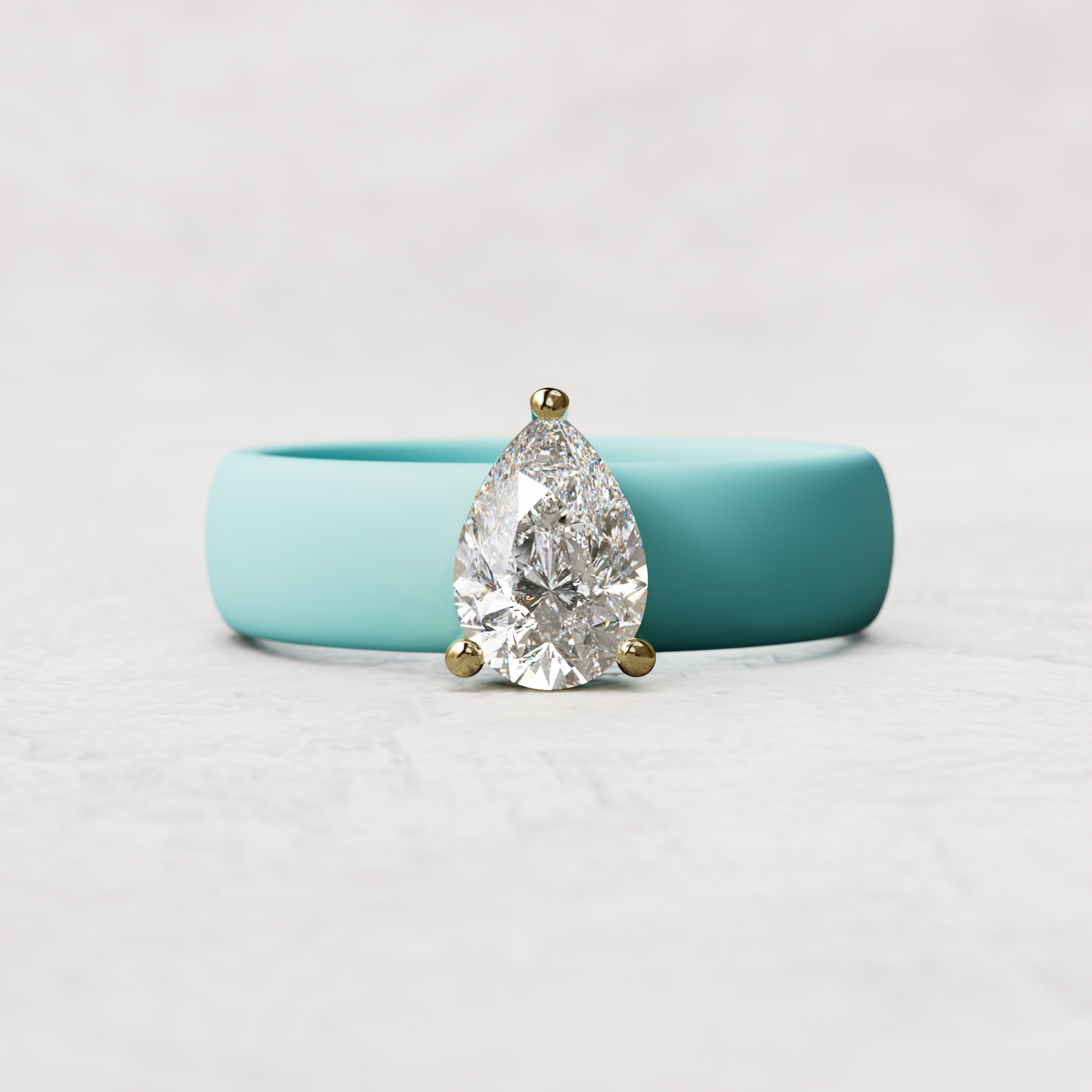 Aqua silicone band with 1 carat pear diamond set in 14 karat Gold