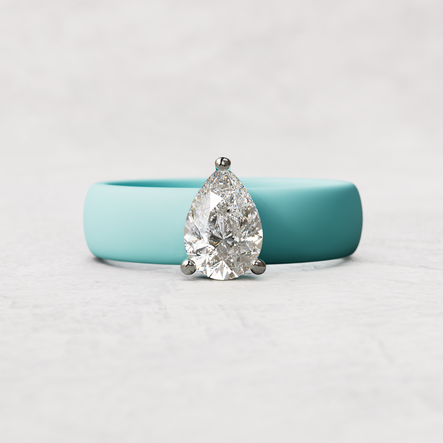 Aqua silicone band with 1 carat pear diamond set in 14 karat white Gold