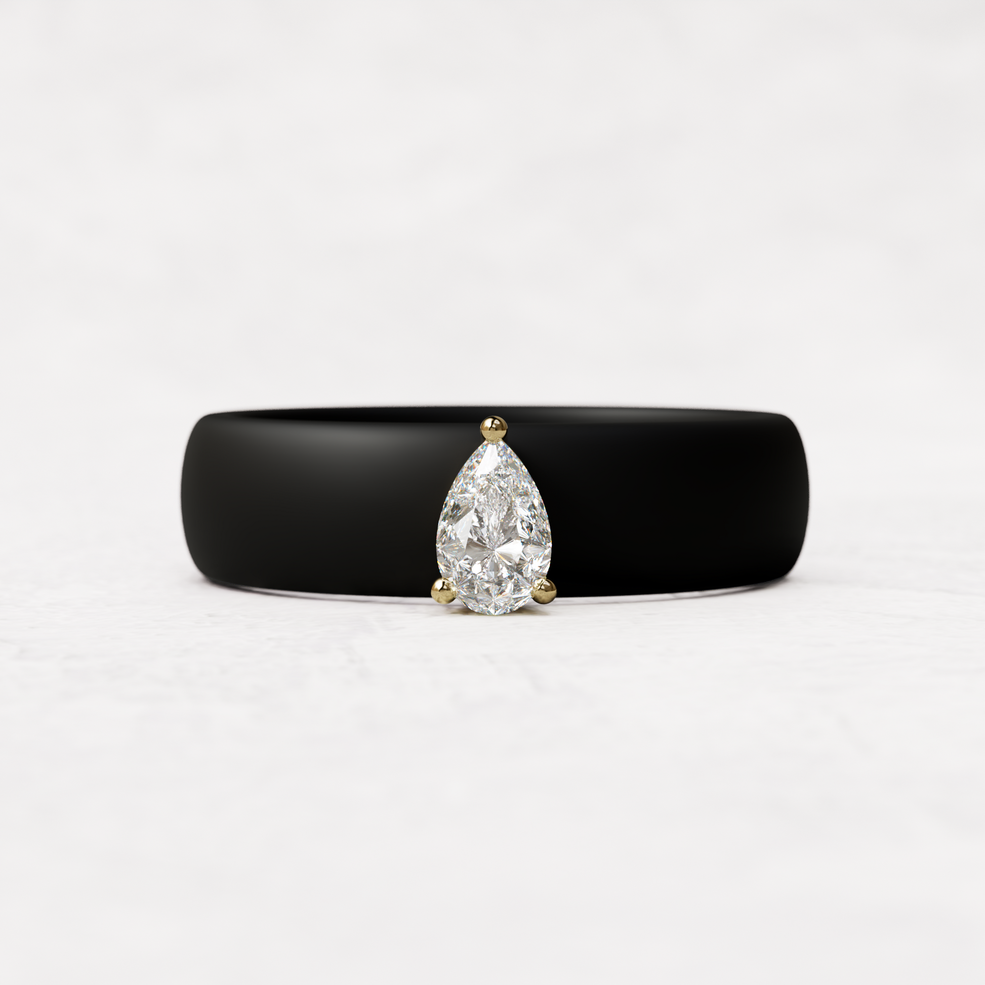 Black silicone band with quarter carat pear diamond ring set in 14 karat Gold 