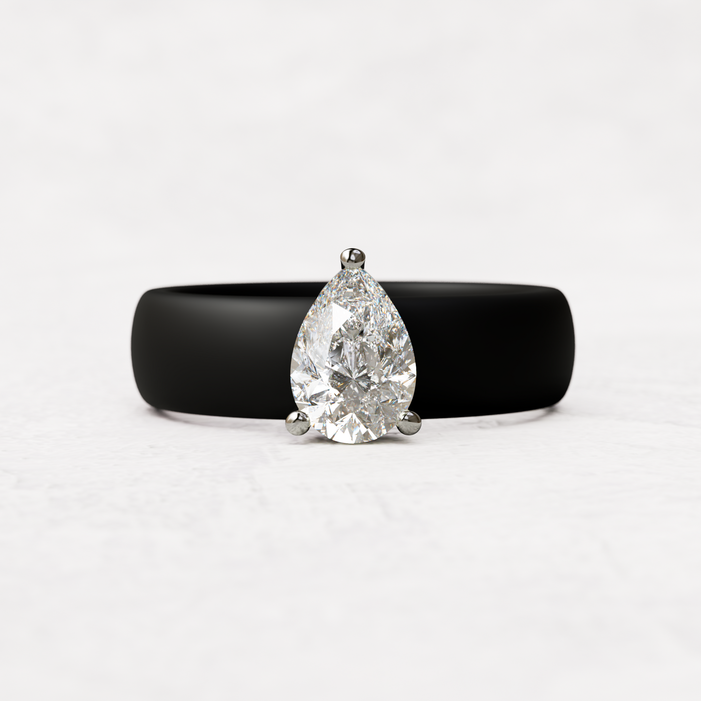 Black silicone band with 1 carat pear diamond set in 14 karat white Gold