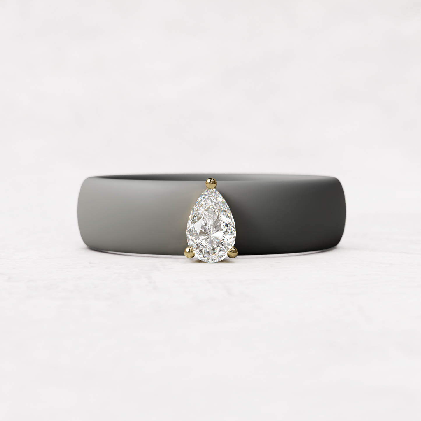 Gray silicone quarter carat pear diamond ring set in 14 karat Gold 