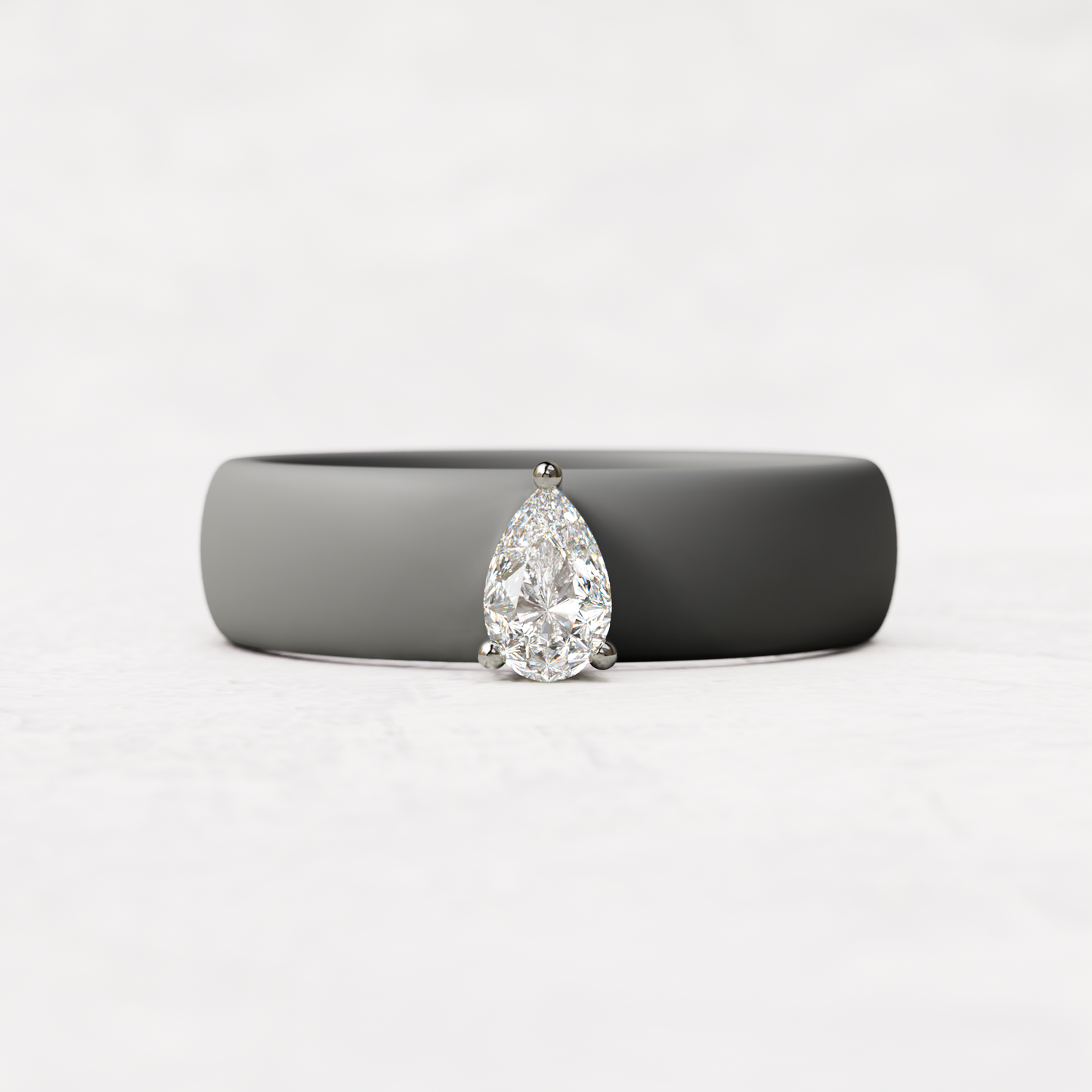 Gray silicone quarter carat pear diamond ring set in 14 karat white Gold 