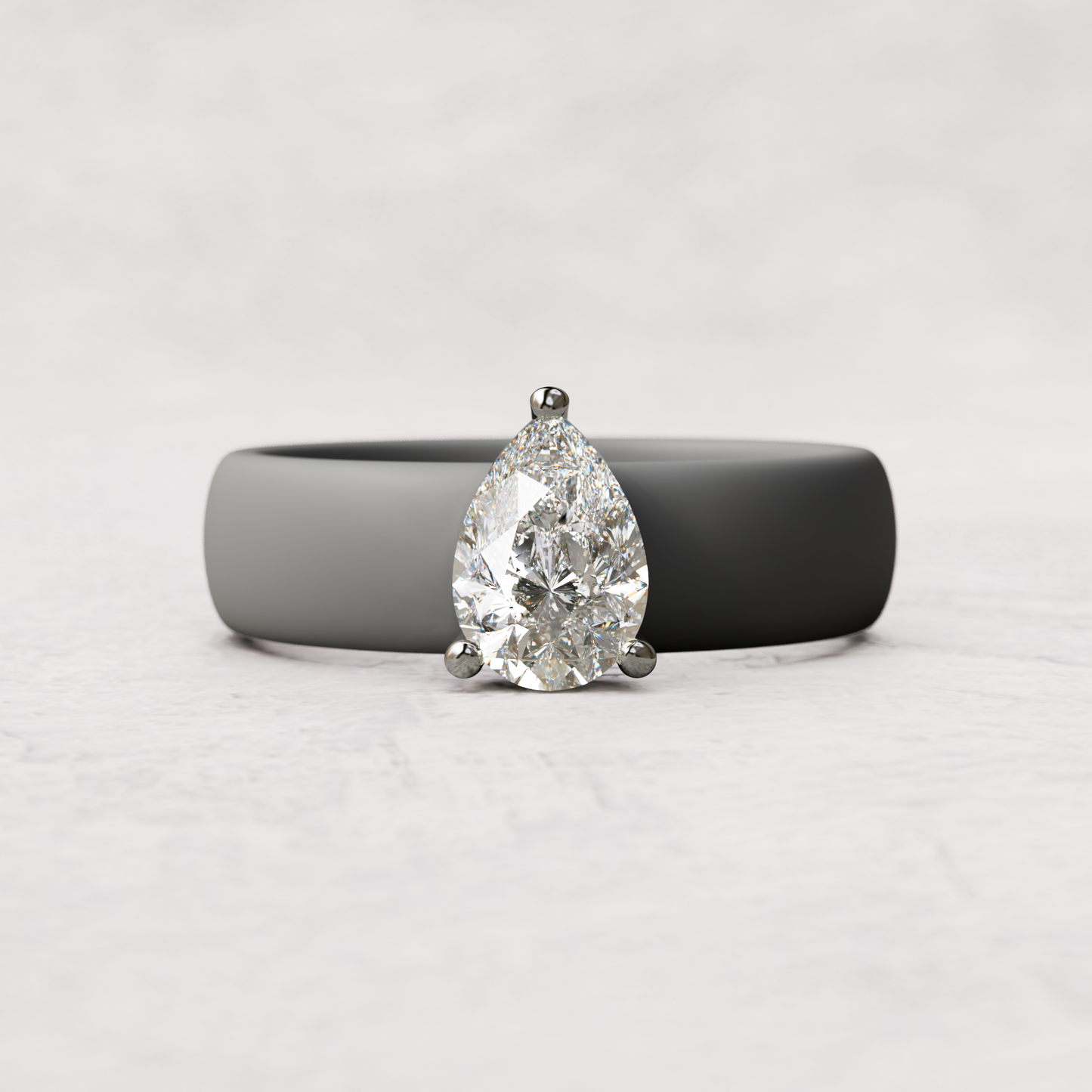 Gray silicone band with 1 carat pear diamond set in 14 karat white Gold