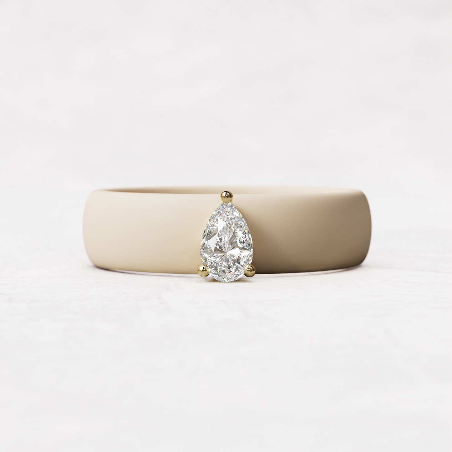 Nude silicone quarter carat pear diamond ring set in 14 karat Gold 