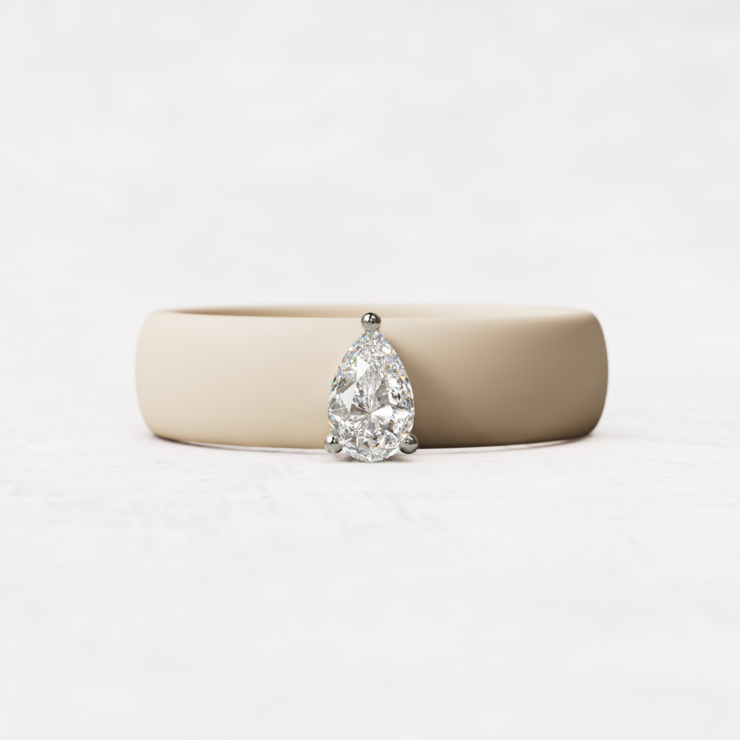 Nude silicone quarter carat pear diamond ring set in 14 karat white Gold 