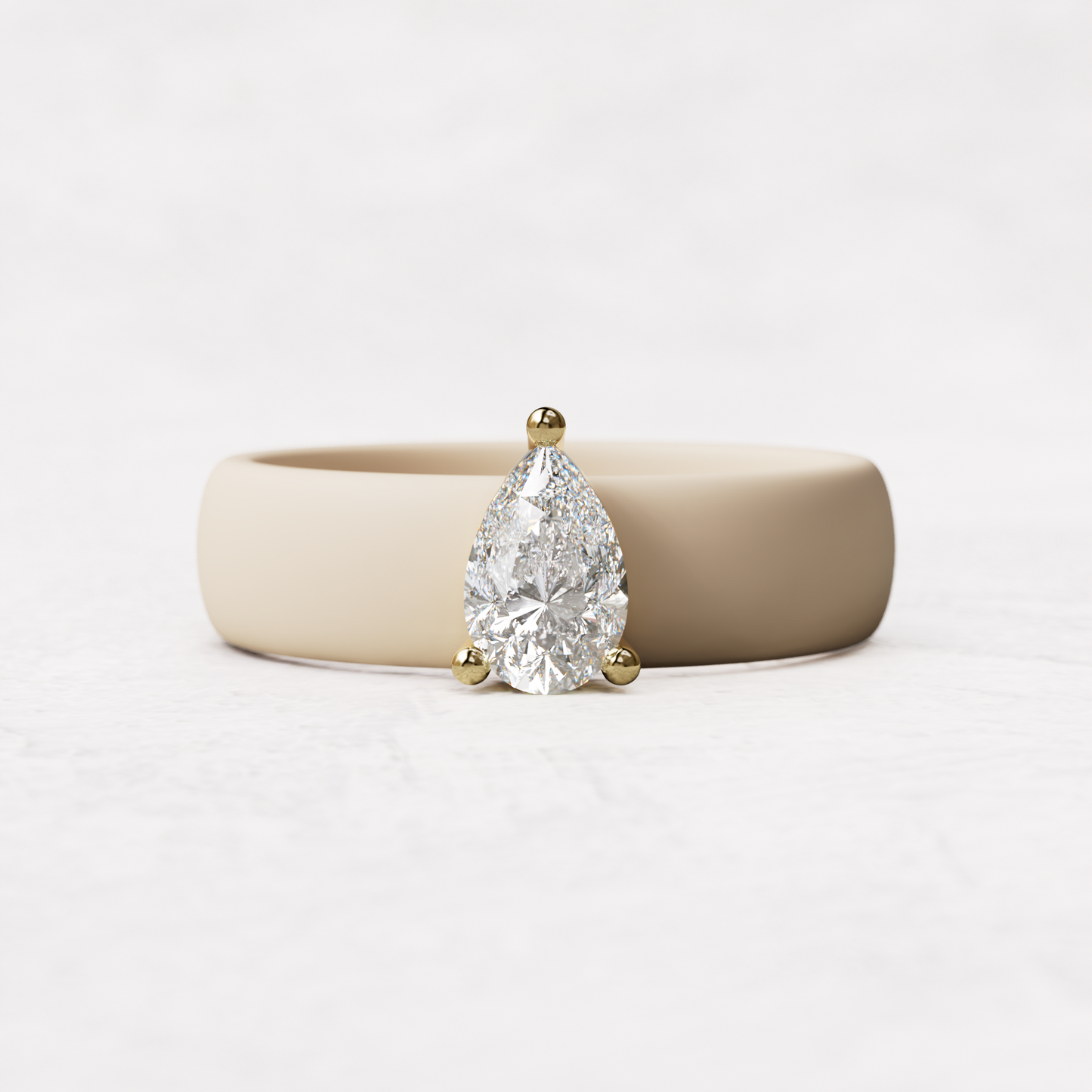 Nude silicone band with .514 carat pear diamond set in 14 karat Gold
