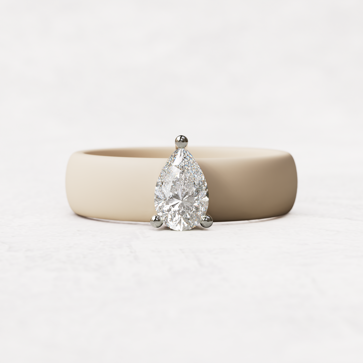 Nude silicone band with .514 carat pear diamond set in 14 karat white Gold
