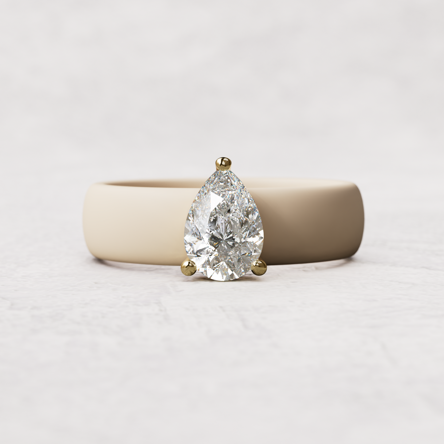 Nude silicone band with 1 carat pear diamond set in 14 karat Gold