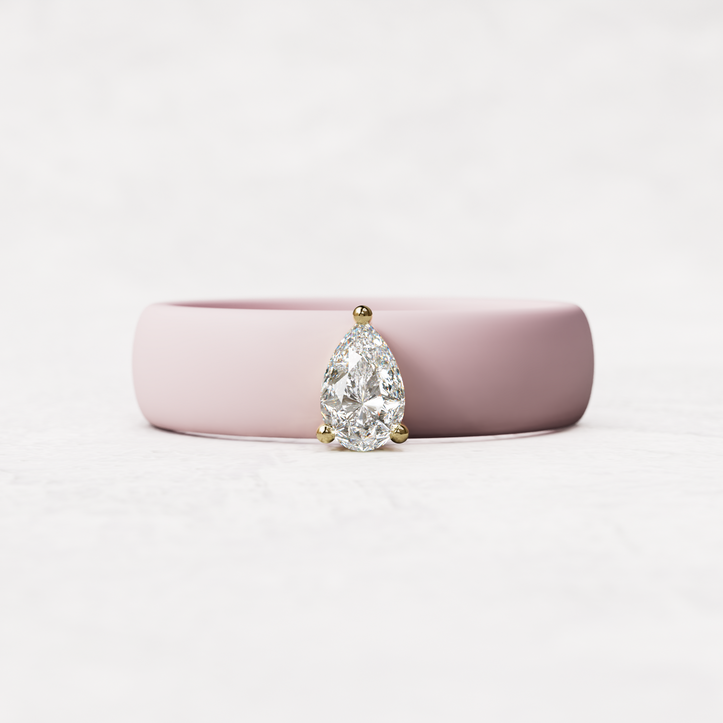 Pink silicone quarter carat pear diamond ring set in 14 karat Gold 