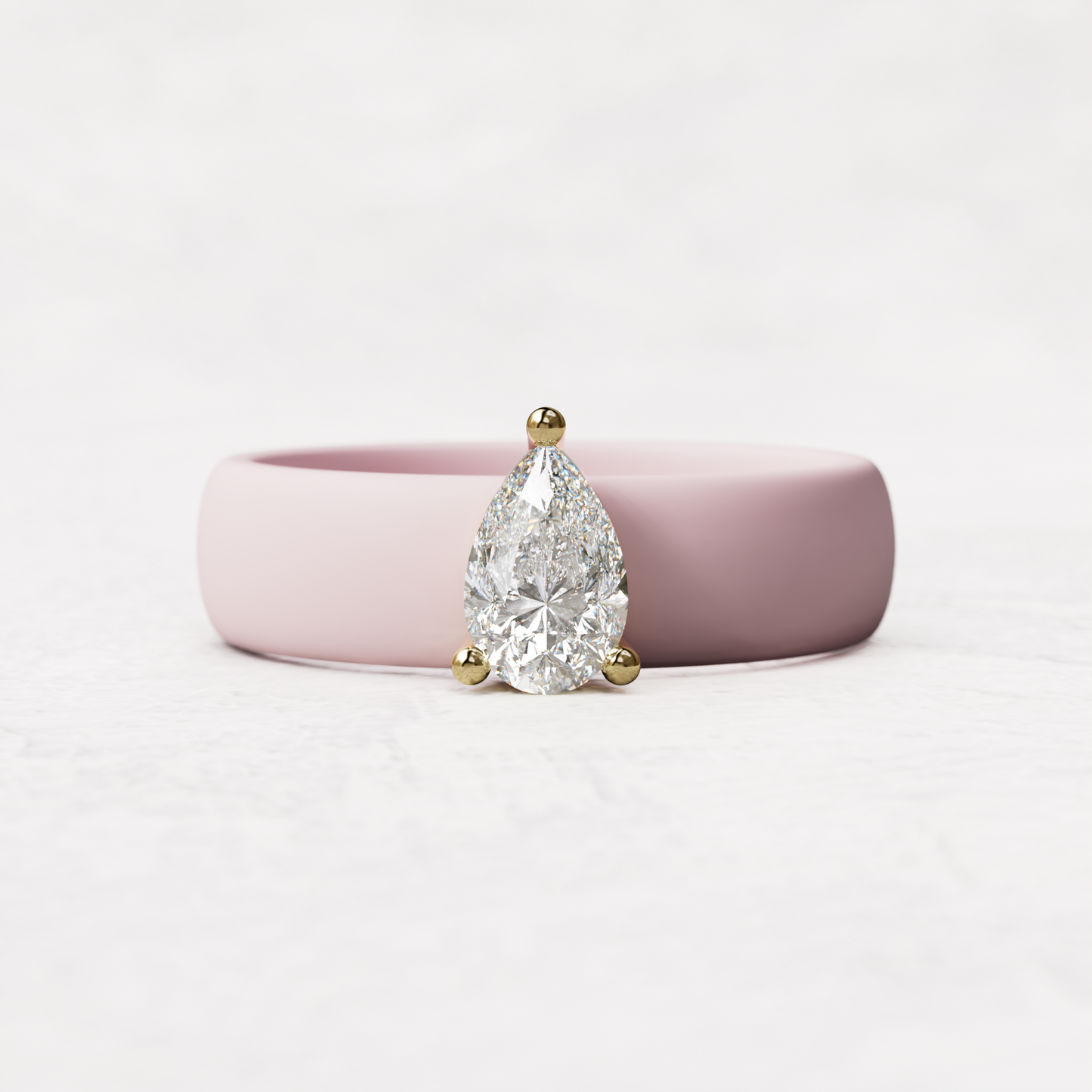 Pink silicone band with .514 carat pear diamond set in 14 karat Gold
