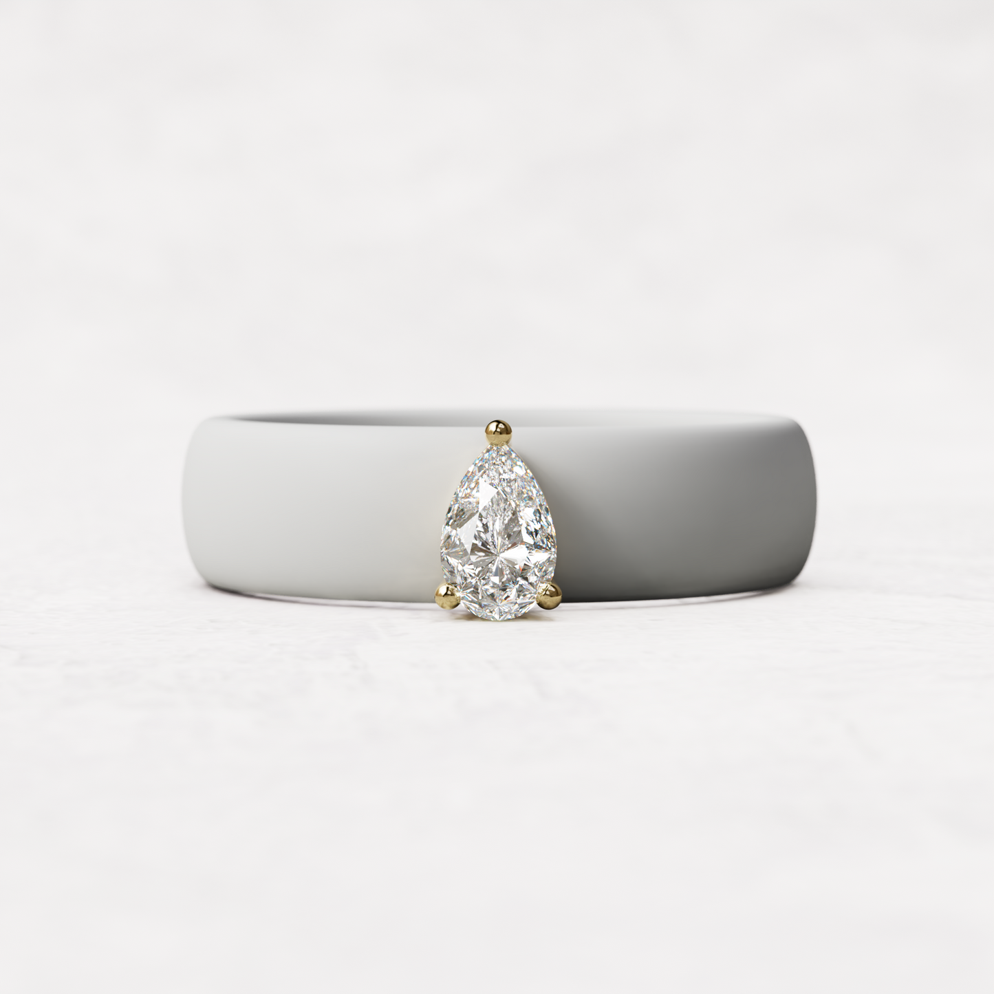 White silicone quarter carat pear diamond ring set in 14 karat Gold 