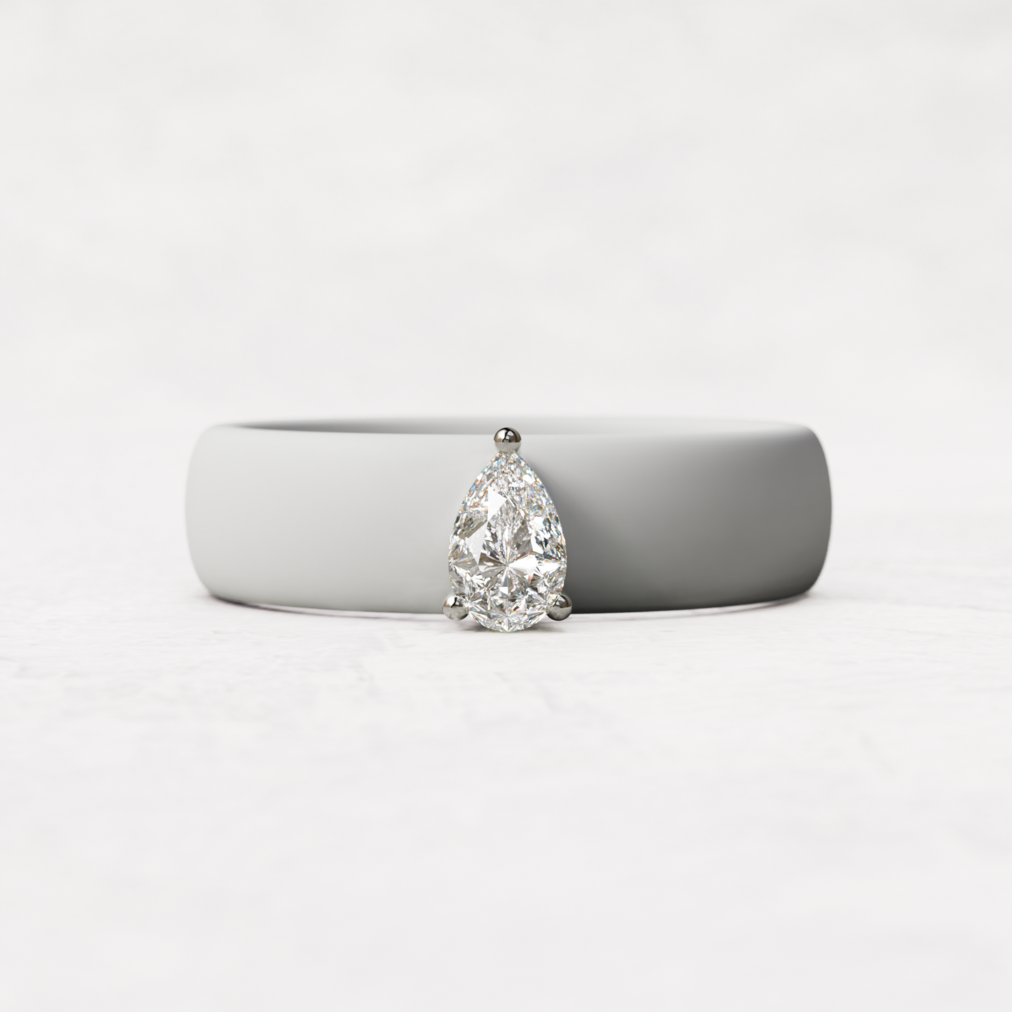 White silicone quarter carat pear diamond ring set in 14 karat white Gold 