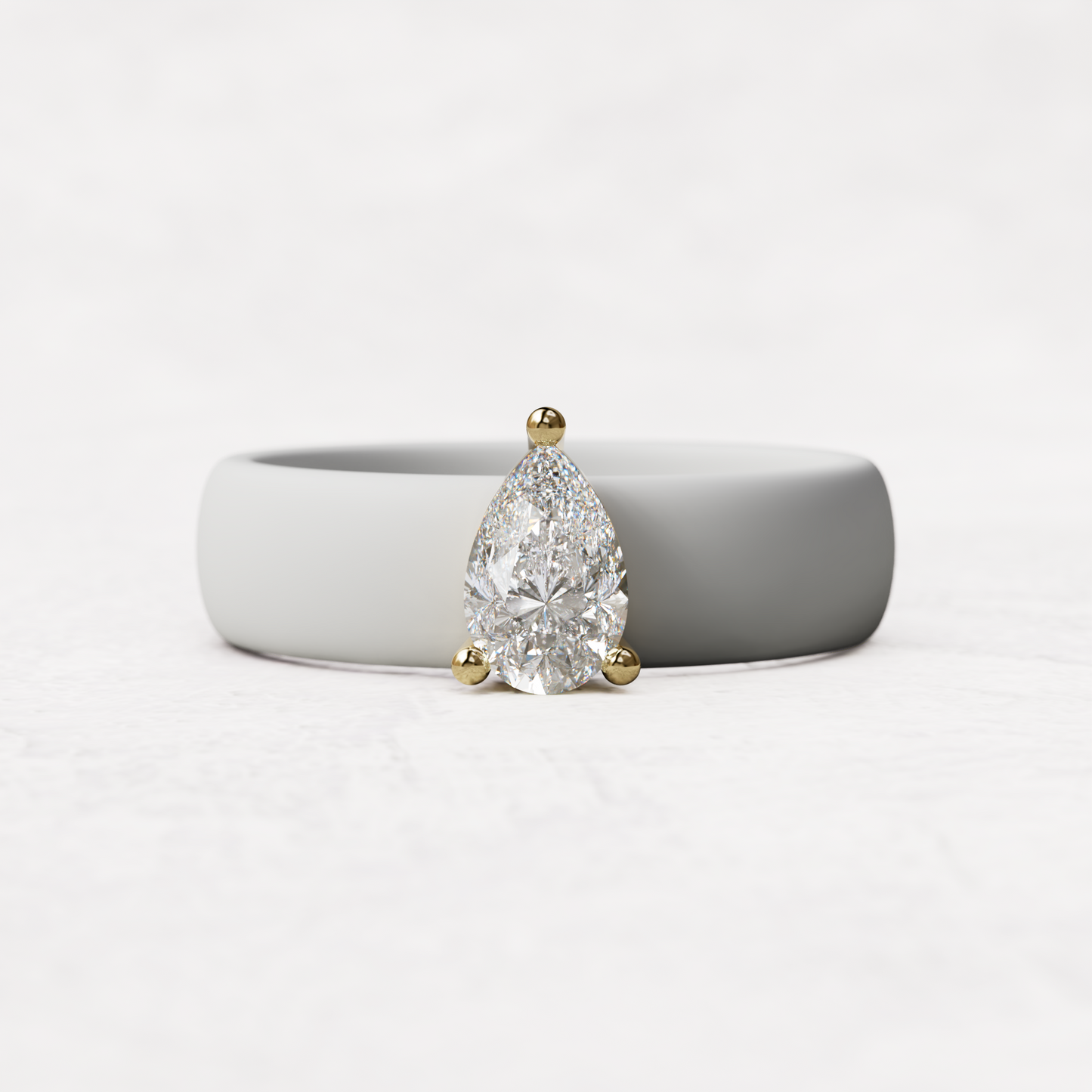 White silicone band with .514 carat pear diamond set in 14 karat Gold