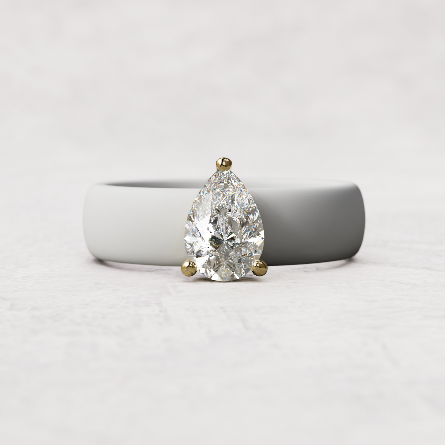 White silicone band with 1 carat pear diamond set in 14 karat Gold