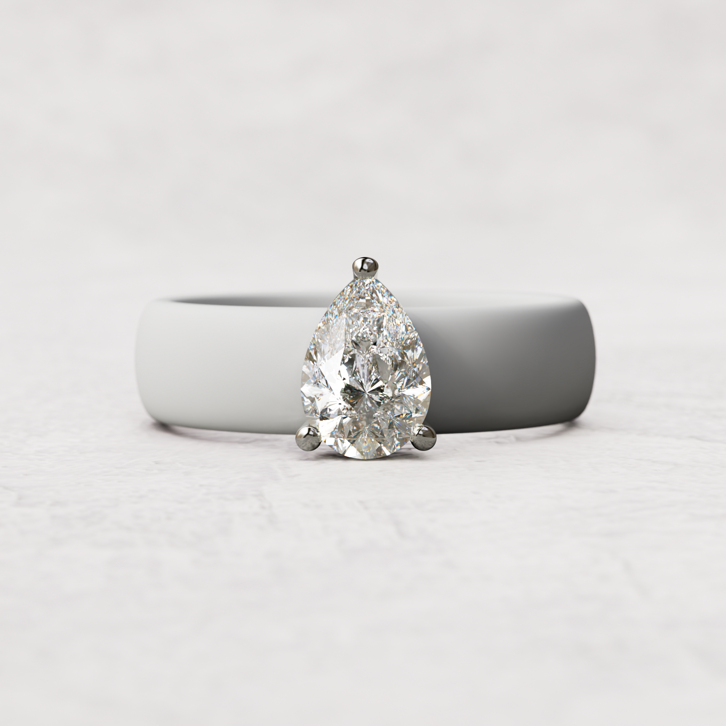 White silicone band with 1 carat pear diamond set in 14 karat white Gold
