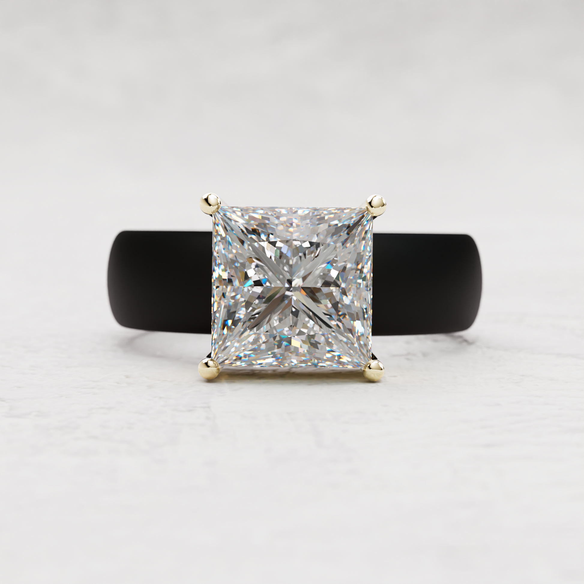 A princess-cut diamond ring with a yellow gold four-prong setting, displayed on a black ring stand against a light gray textured background.