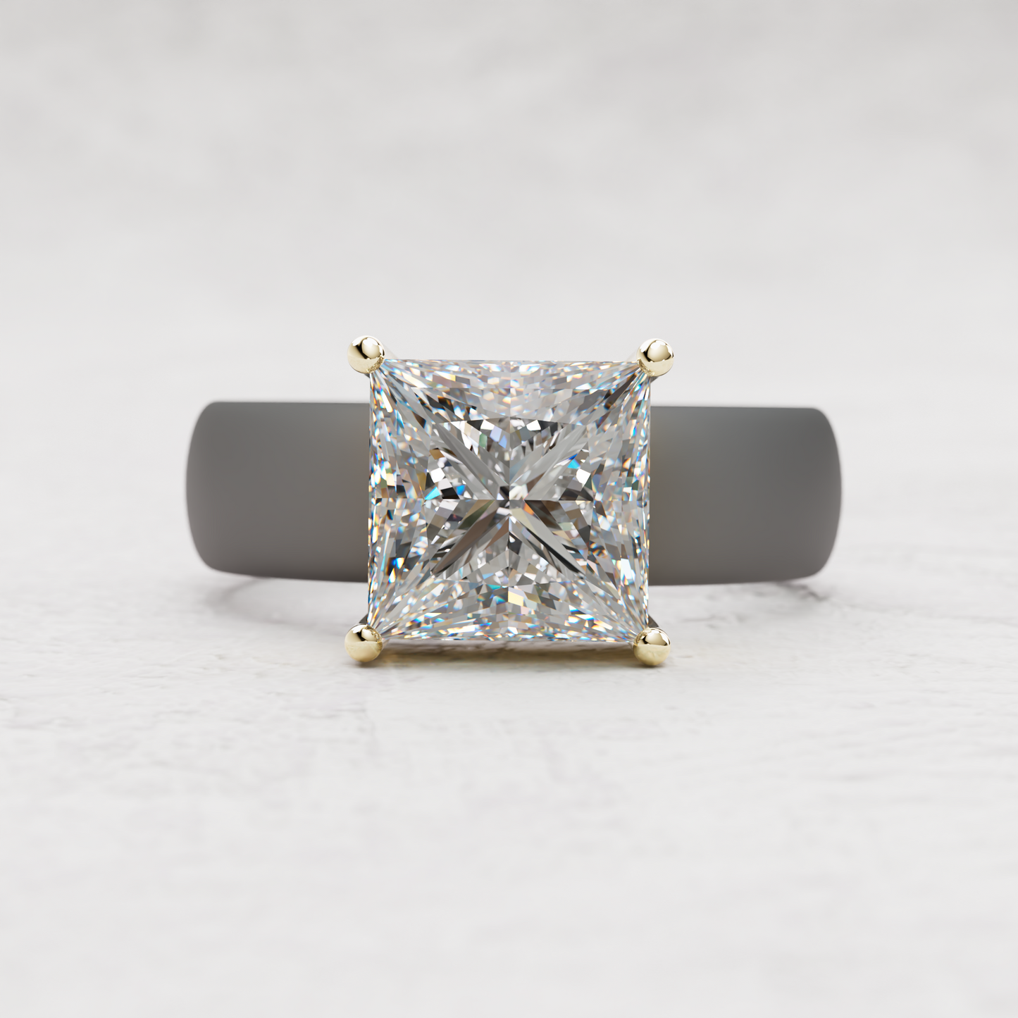 A princess-cut diamond engagement ring with a yellow gold four-prong setting, displayed on a dark gray ring stand against a light gray textured background.