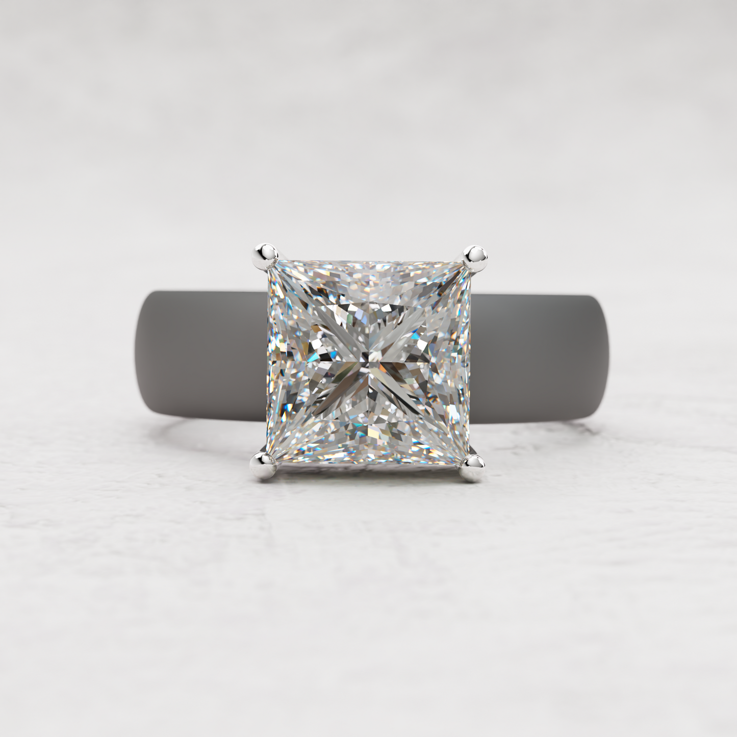 A princess-cut diamond engagement ring with a yellow gold four-prong setting, displayed on a dark gray ring stand against a light gray textured background.